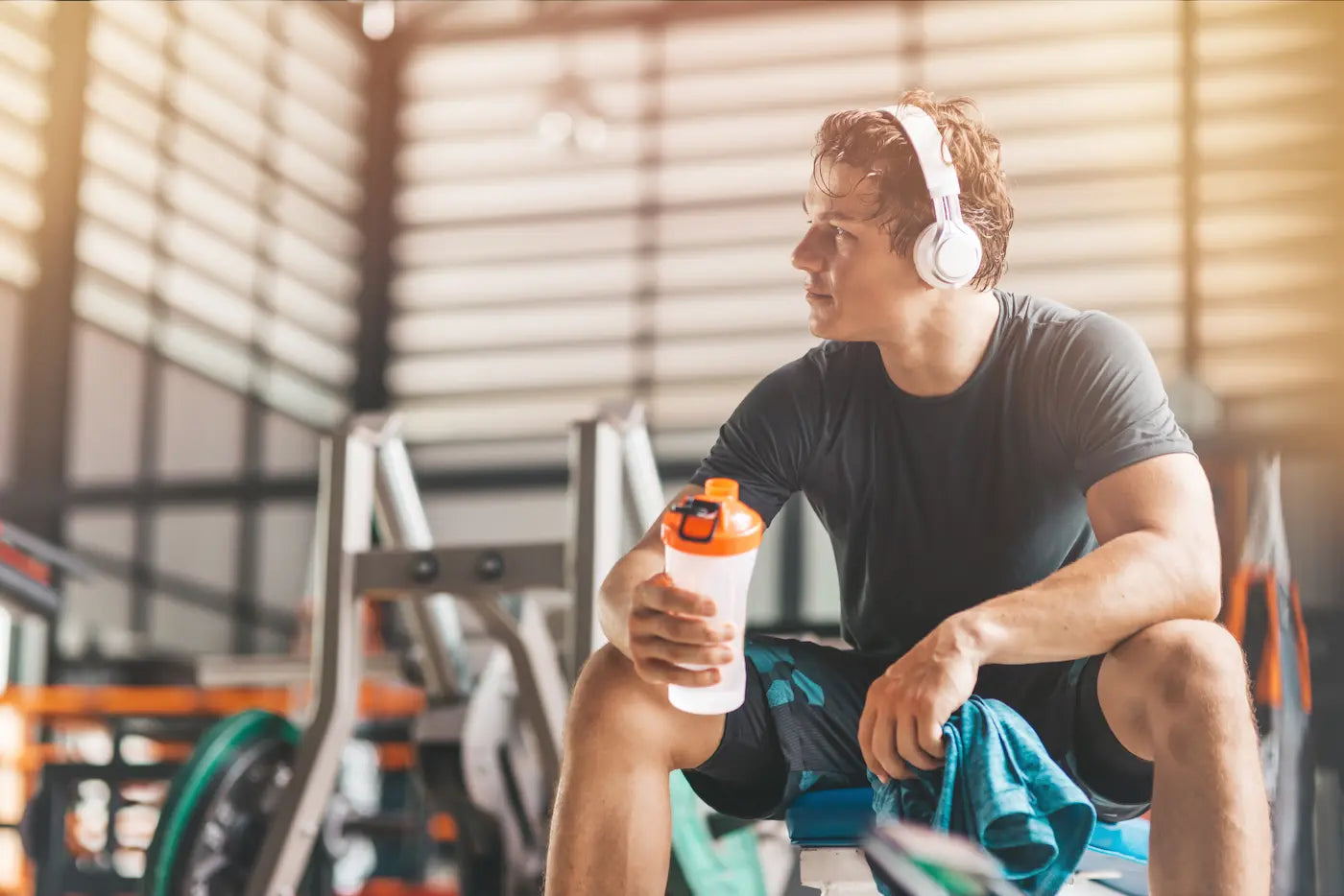 Busy person preparing for a workout with all-natural preworkout supplement