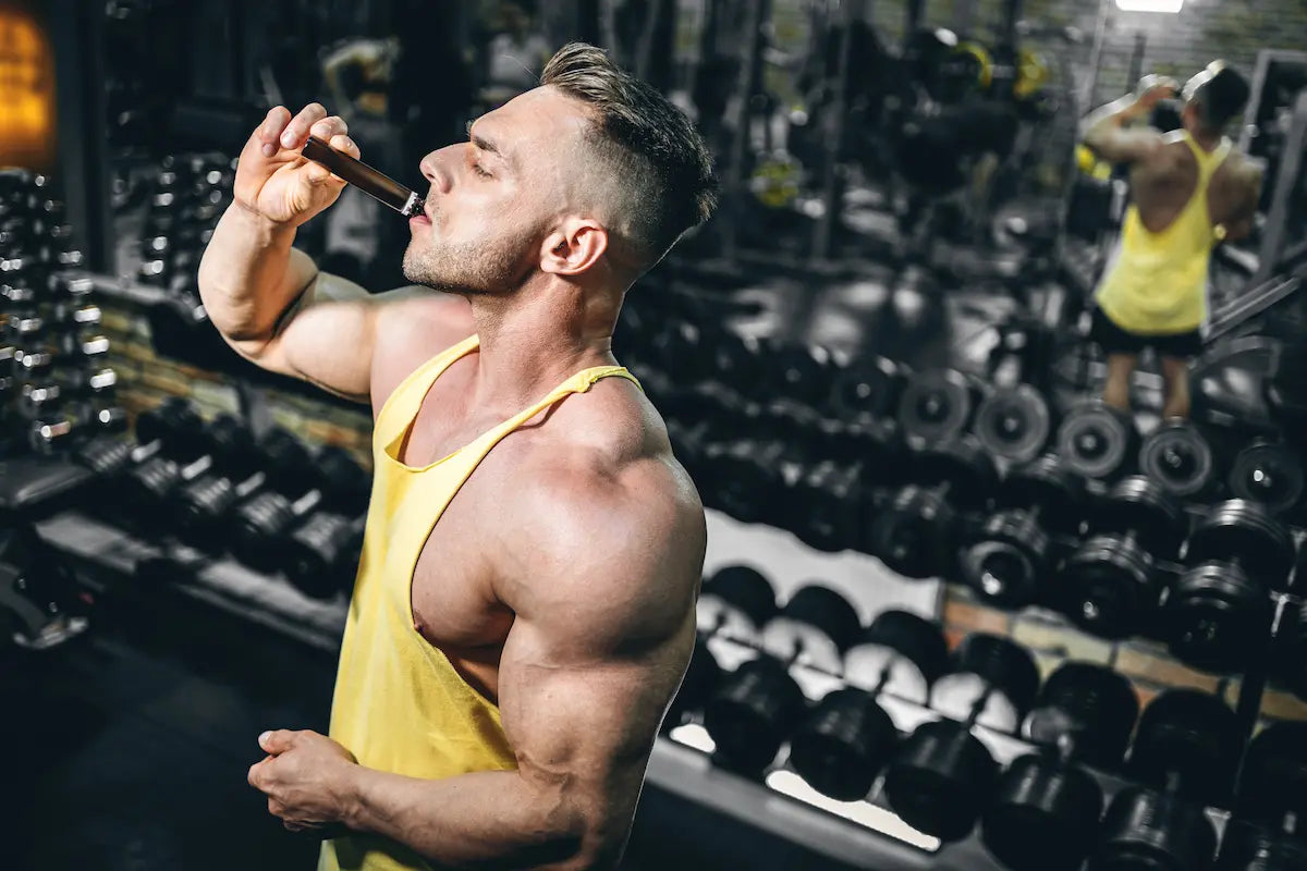 A man drinking carnitine and getting benefits while at the gym