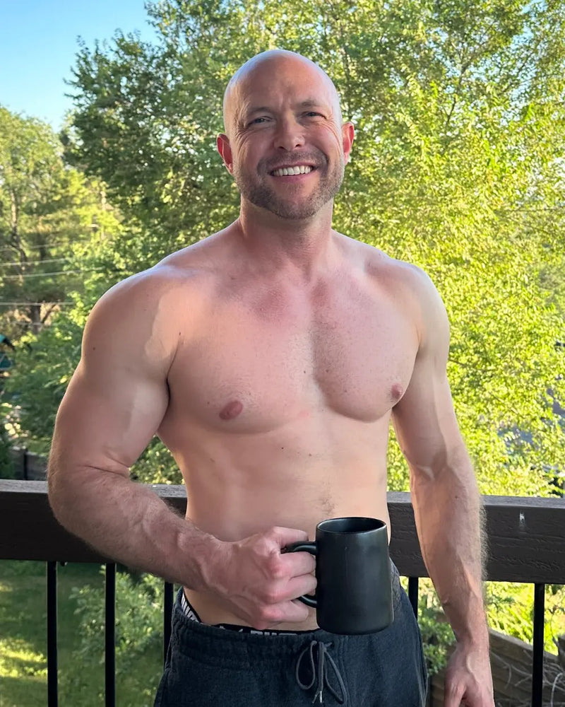 Connor, founder of 4 Gauge, holding PowerPhase Creatine